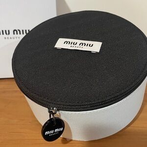 Miu Miu Two-Tone Round Cosmetic Case in Black & miu miu Sky Blue